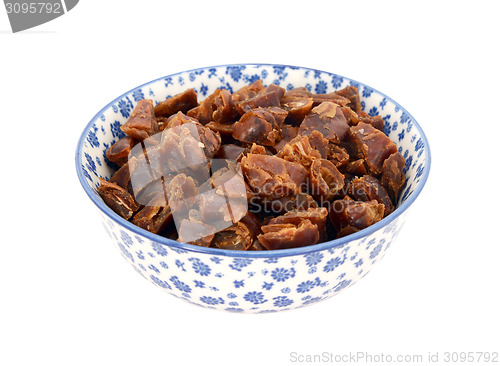 Image of Chopped dates in a blue and white china bowl