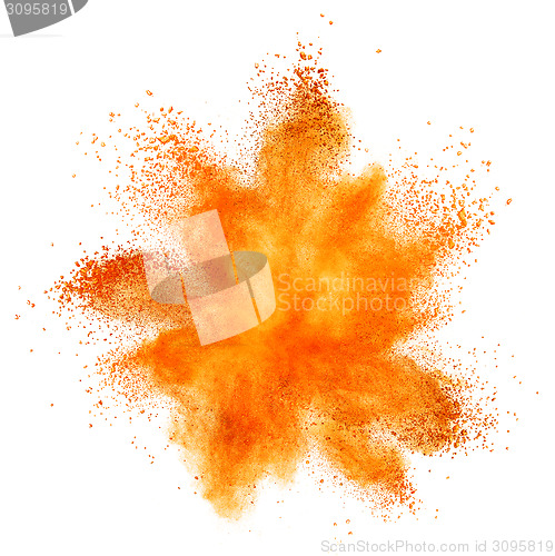 Image of orange powder explosion isolated on white