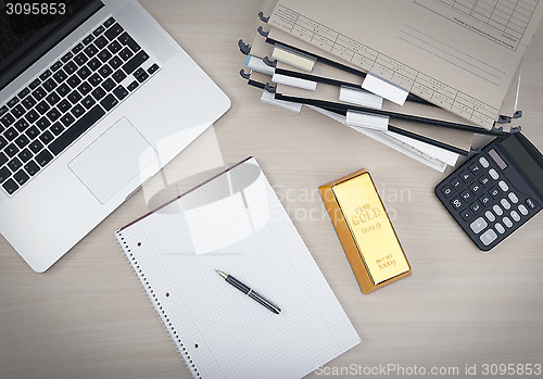 Image of Workplace with a gold bar