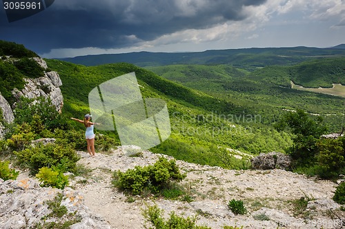 Image of Young woman against the storm