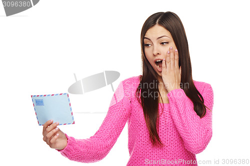 Image of Surprised woman looking at envelope