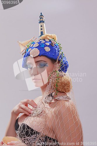 Image of Beautiful woman with extravagant headdress