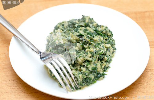 Image of Scrambled egg with spinach and fork