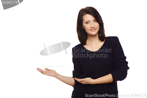 Image of Smiling woman showing open hand palm