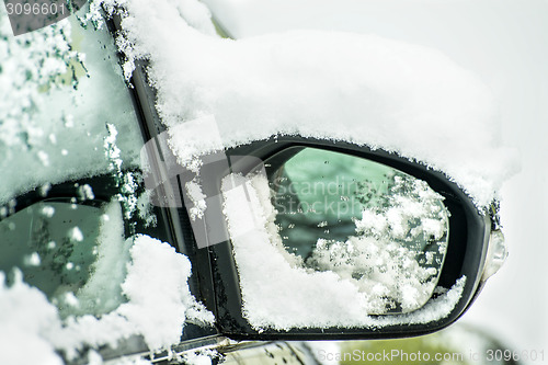 Image of snowhat on a car mirror