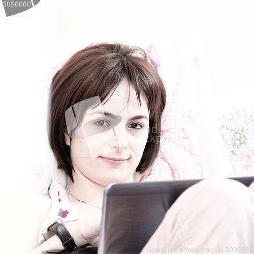 Image of Young woman with laptop 