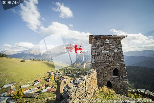 Image of Georgia flag mountain village towers tourism