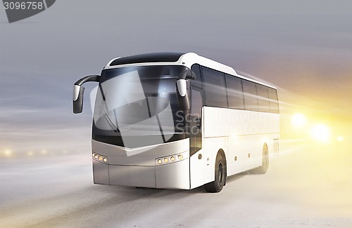 Image of bus on ice road in blizzard