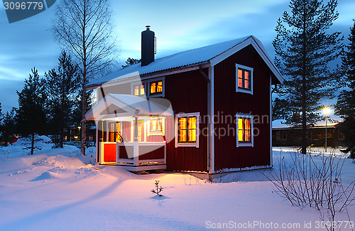 Image of wooden house in Sweden during winter