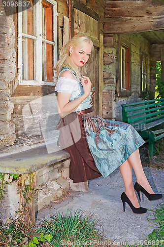 Image of Fashionable young woman with Dirndl posing,