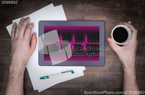 Image of Electrocardiogram on a tablet - Concept of healthcare