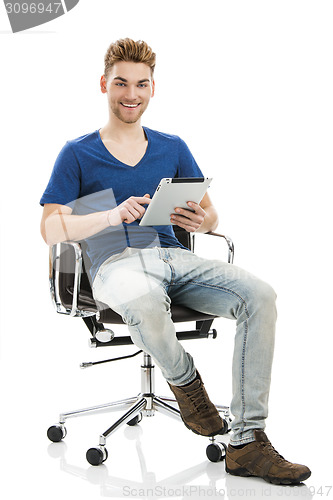 Image of Young man working with a tablet