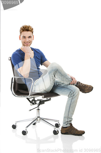 Image of Young man sitting on a chair