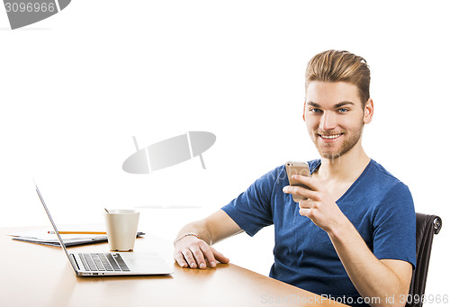 Image of Young man sending text messages