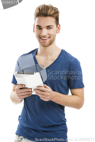 Image of Young man working with a tablet