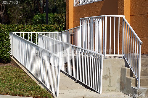 Image of handicap ramp with white railing