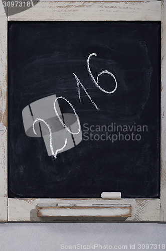 Image of vertical slate blackboard with the inscription 2016