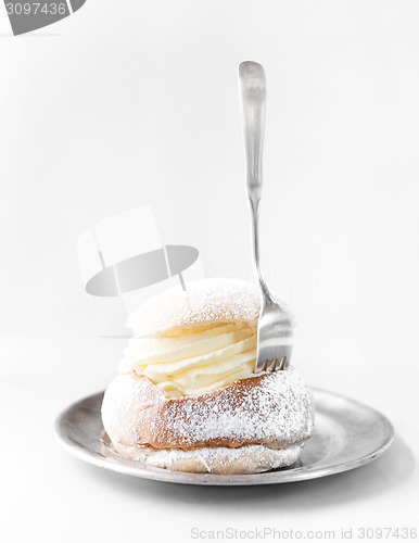 Image of Semla cream bun on silver plate