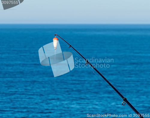 Image of Fishing Bait-Rod with Float against the Blue Sea Water Surface