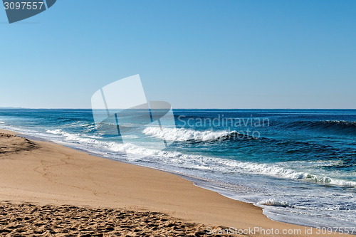 Image of Waves in the Ocean Crashed on Sand Beach