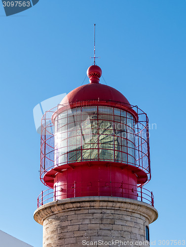 Image of Red Lighthouse on the Background of Blue Sky