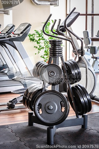 Image of Barbell plates rack in the gym