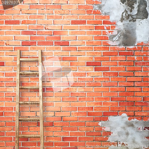 Image of red brick wall with wooden ladder