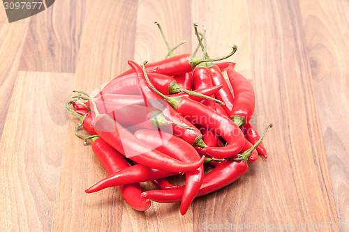 Image of Red chili on wooden board