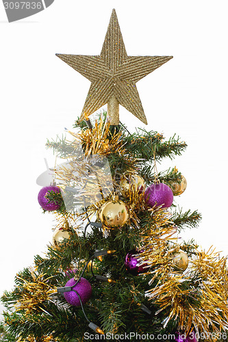 Image of Decorated christmas tree with yellow and violet balls