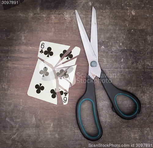 Image of Concept of addiction, card with scissors