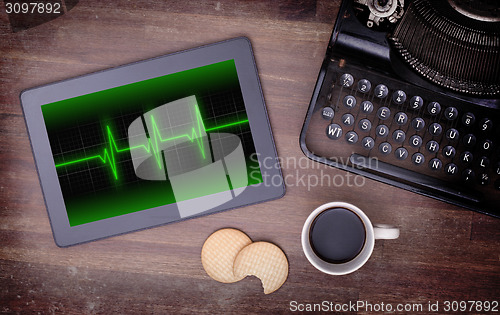 Image of Electrocardiogram on a tablet - Concept of healthcare