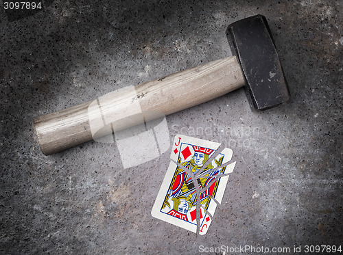 Image of Hammer with a broken card, jack of diamonds