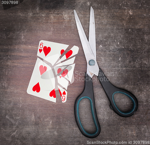 Image of Concept of addiction, card with scissors