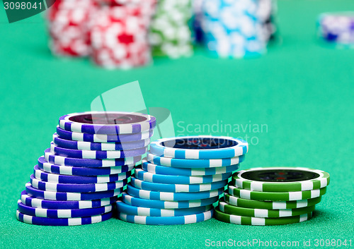 Image of stack of chips on a green table