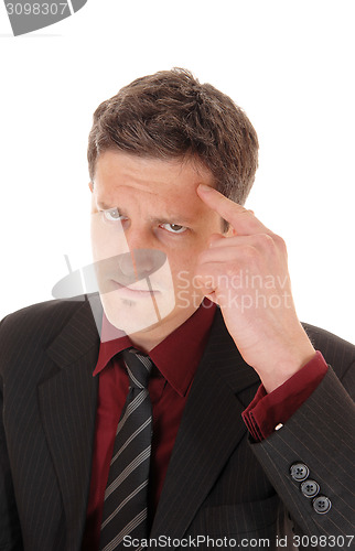 Image of Man with finger on forehead.