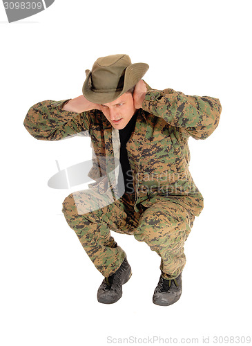 Image of Soldier crouching on floor.