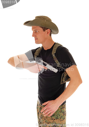 Image of Soldier pulling his handgun.