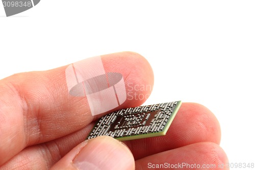 Image of computer chip in the human hand 