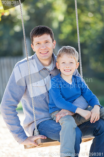 Image of family at swings