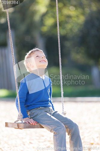 Image of boy at swings