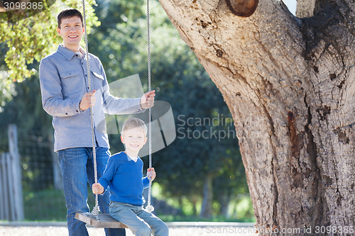 Image of family at swings