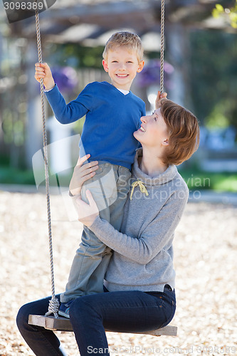 Image of family at swings