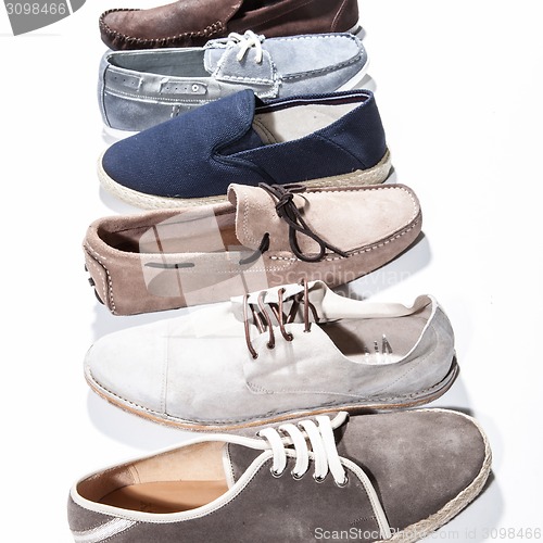 Image of Set of man footwear on a white background