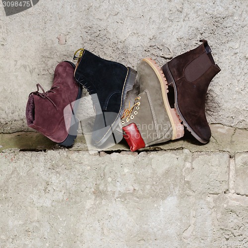 Image of Set of man footwear on a grunge  background