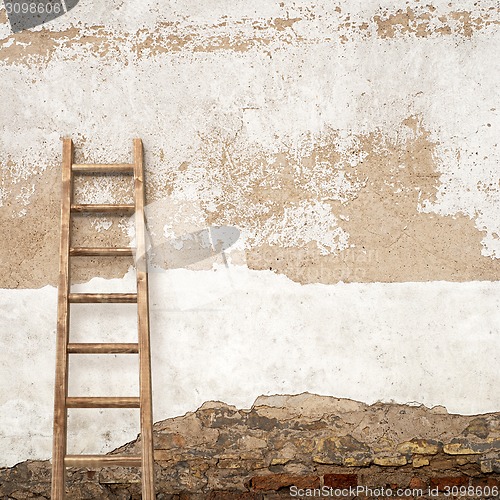 Image of stucco wall with wooden ladder