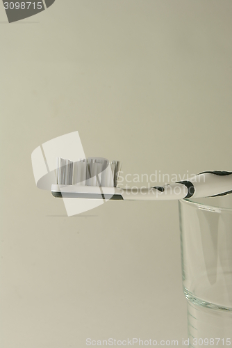 Image of toothbrush on a glas