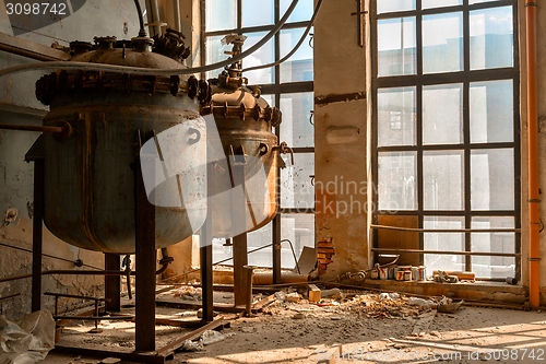 Image of Industrial containers in abandoned interior