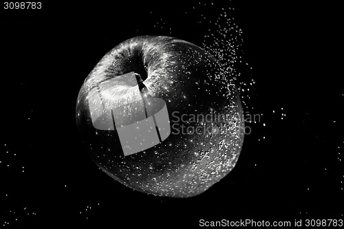 Image of Small apple in see trough water