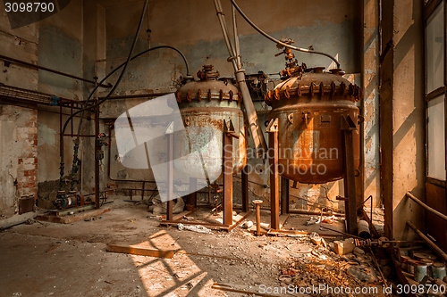 Image of Industrial containers in abandoned interior