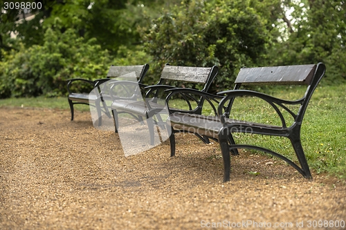 Image of Stylish bench in autumn park